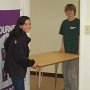 Moving a table in the basement.