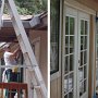 (Left) David McCreath paints a strip of trim.  <br />(Right) Finished coat of exterior paint.