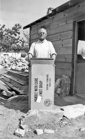 005.jpg - Rev. Simpson preaches at the building site, 1946