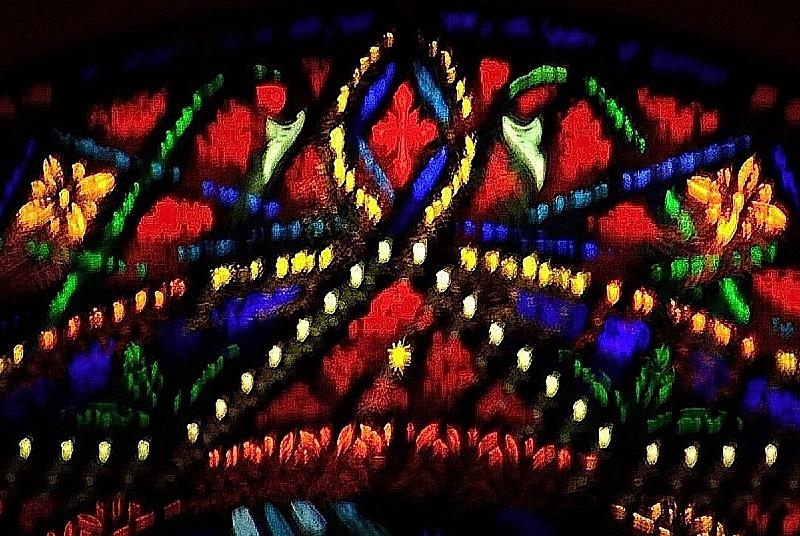 StainedGlassWindow.jpg - At the top of the stained glass window is this colorful scene.