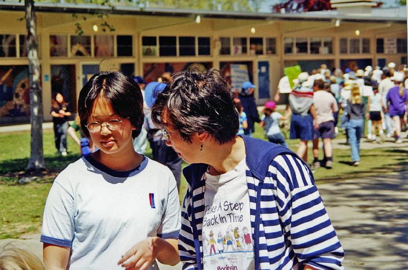 2000-2.jpg - Isabel and Margaret Wei converse at the 2000 Crop Walk.