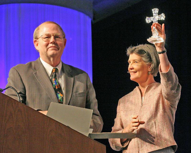 183.jpg - The Rev. Joan S. Gray lifted high the crystal cross she received as a symbol of her term as moderator of the 217th General Assembly. Photo by Danny Bolin