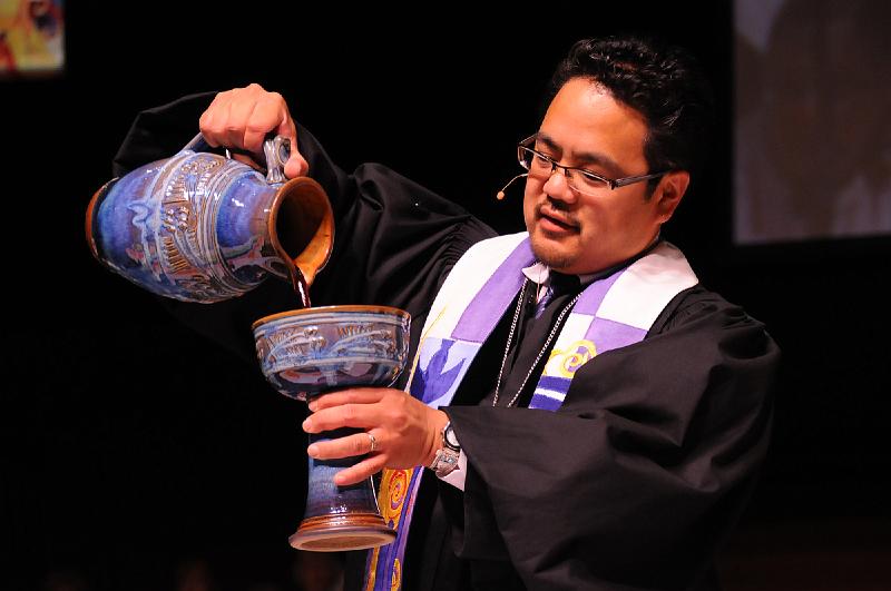 240.jpg - The Rev. Bruce ReyesChow, moderator of the 218th General Assembly, presided over Communion at Sundays opening worship service at the San Jose State University Event Center. Photo by Joseph Williams