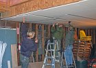 DSC 0076  Some of us install a second layer of sheetrock on the ceiling of a room in the shop.  This will form a fire break.  L-R: Jordy Pearson (Westminster Woods staff), Phil Curtis and Leland Wong.