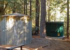 DSC 0091  Uphill from the main camp area there are storage tanks that hold spring water.  On the left is one of the present tanks; to the right is one (of two) new and larger ones being built.