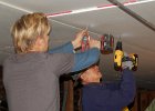 DSC 0106  Jordy and Leland fastening sheetrock to the ceiling.