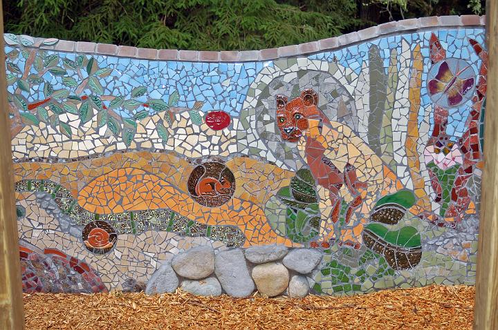 DSC_0068.jpg - Detail of the mosaic wall mural.  It has a creation theme, and the arrival of creatures is shown here.