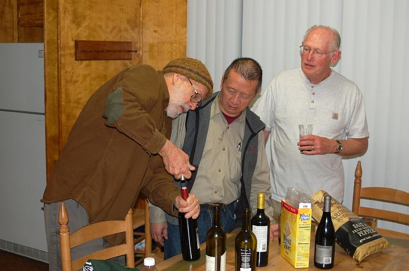 63.jpg - How many Presbyterians does it take to open a wine bottle?  Ideally, 38.  Not having that many, we had to make do, but the cork eventually came out.  (BTW, this took place AFTER our work was done!)
