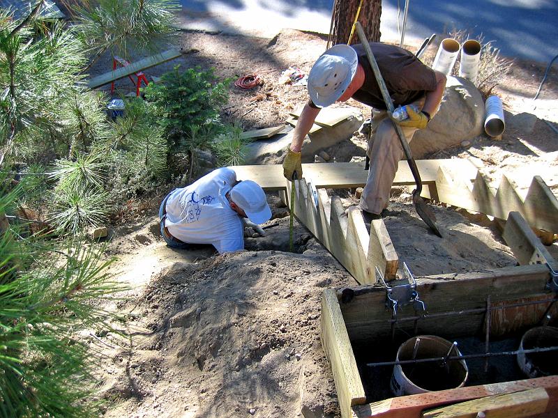 117_1750.jpg - While retaining wall was being poured (foreground), John and Art set piers.