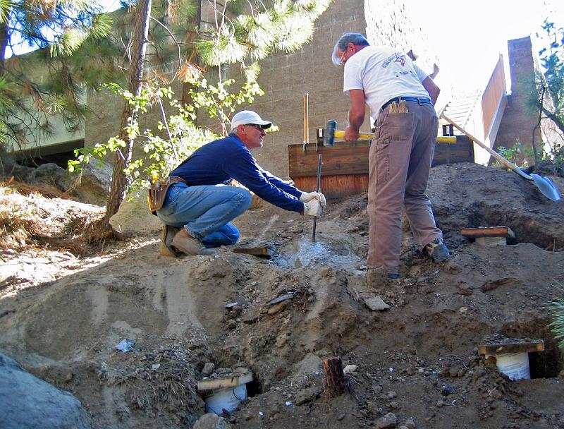 117_1754.jpg - John and David McCreath breaking a granite boulder.