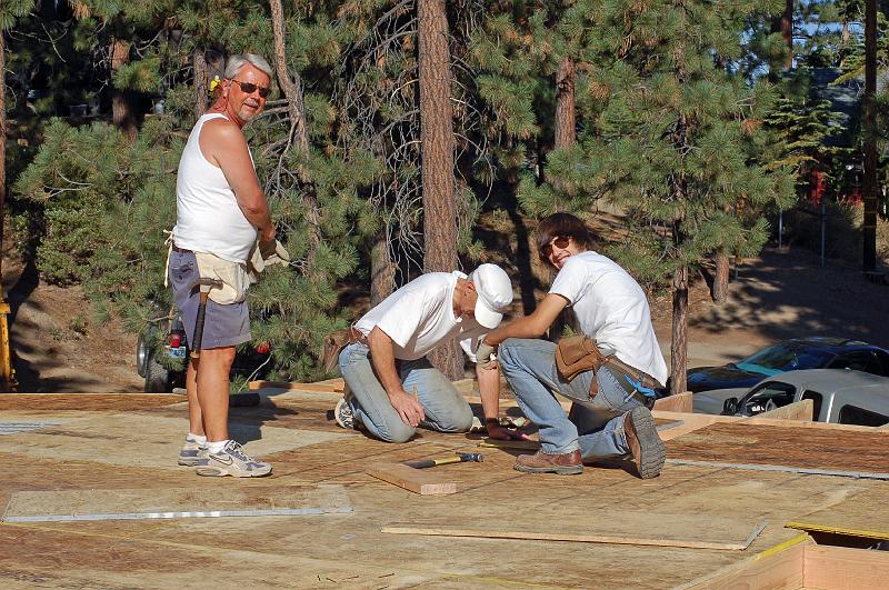 308.jpg - Michael, John and David install the plywood.