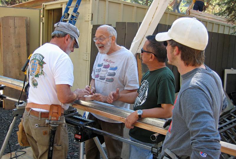404.jpg - David McCreath, Bill Lakatos, Leland and Gordon attach the door track to its framing piece.