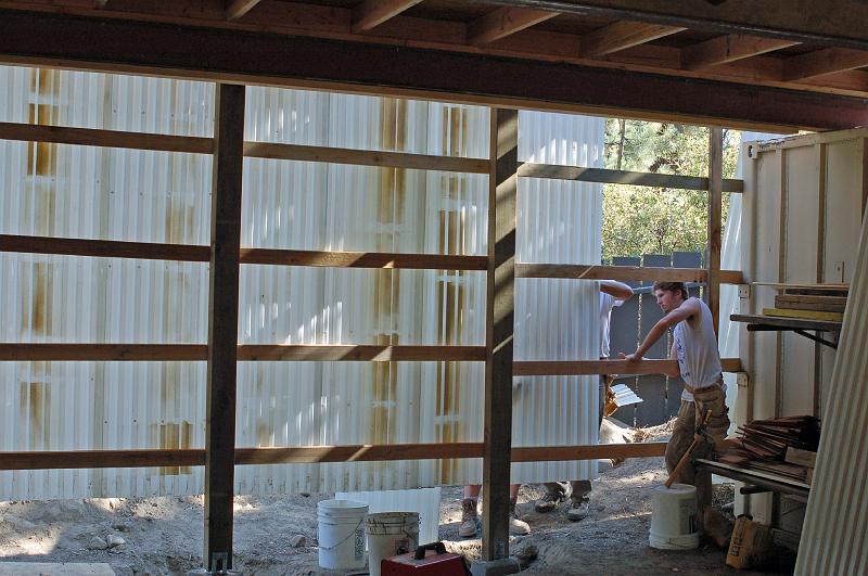 410.jpg - The back wall is practically finished.  Gordon observes its progress.