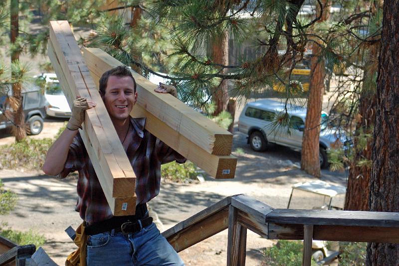 DSC_0053.JPG - Chris takes his turn carrying lumber up that long stairway.
