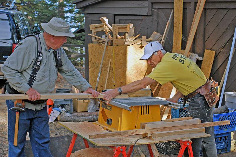 DSC_0105.JPG - Lawrence and John sawing another piece for a railing section.