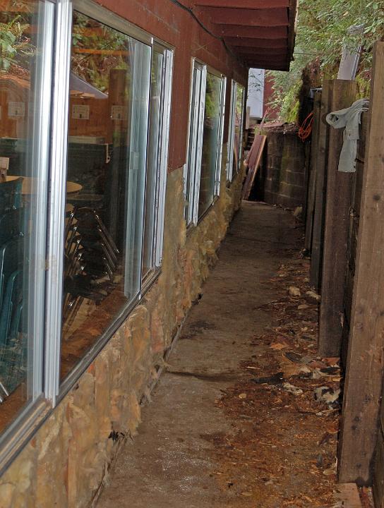 M10-24.JPG - Rotten lower siding is removed, exposing the underlying insulation.  Tar paper would be applied next.  (Mar 2010)