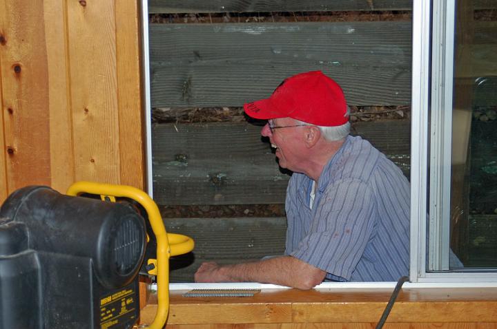 M10-39.JPG - Gary pauses during work on the siding project.  (Mar 2010)