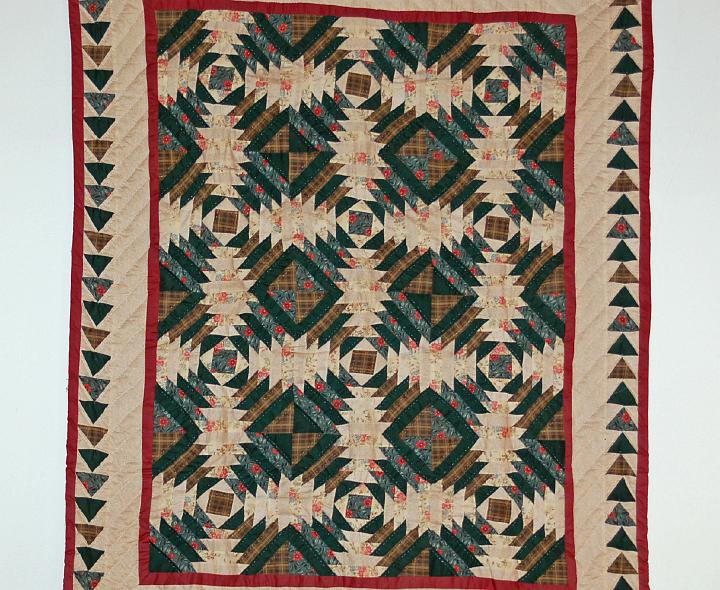 M10-45.JPG - We returned to Westminster Woods for more projects in March 2010.  Here's a closeup of a decorative quilt mounted in the cabin where we slept.