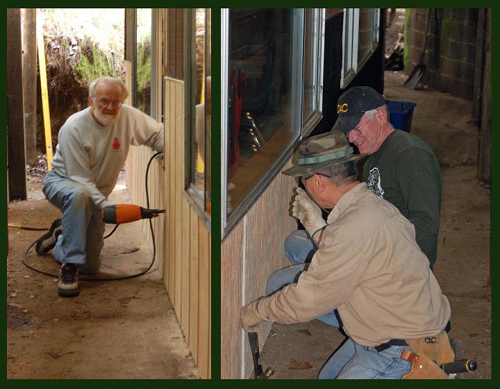 M10-C1.jpg - Rod Thorn (left) has a go with the nail gun; Leland and Bill (right) fit a new siding panel in place.  (Mar 2010)