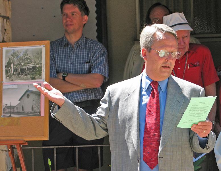 105.jpg - Rev. Art Mills (Stone Church Senior Pastor at the time) reads the Groundbreaking Ceremony Proclamation.  In the background are Gabriel Faber (left) and Leonard Lewis and Bruce Raby (right, partially obscured).