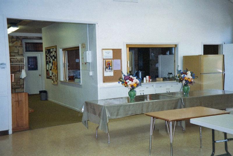 203.jpg - Another view of the Social Hall, with a clearer view of the two pass-through counters and the hall leading to the Chapel.  The old kitchen was behind the pass-through counters.