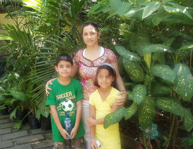 A001.jpg - Mirtala Lopez, with her two children, won an international award for her human rights work during the civil war.  Arlene Schaupp (Palo Alto First Presbyterian) is godmother to the children.