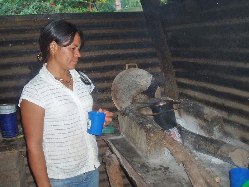A053.jpg - Cooking over a pit fire.