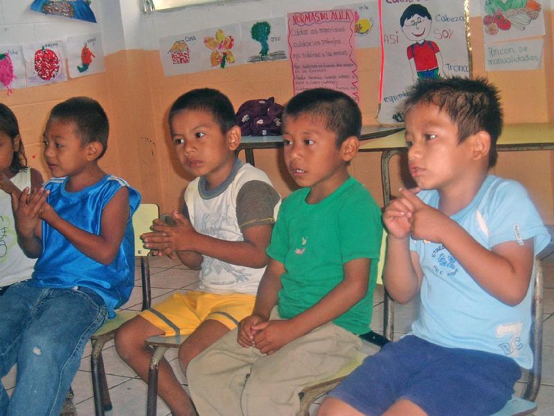 A067.jpg - Boys in the COO child care center are engaged in an action song.