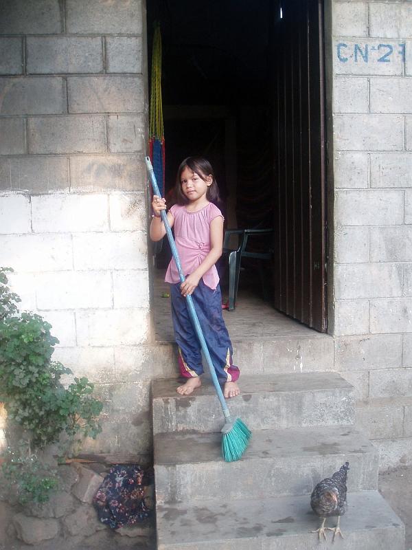 A086.jpg - Six-year-old Carmencita swept the steps on her own initiative.