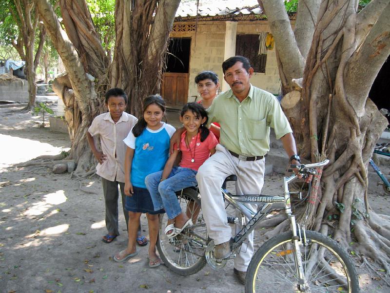MK156.jpg - Javier (holding bicycle) is head of the COO Village Council.  He and his family hosted Mark.