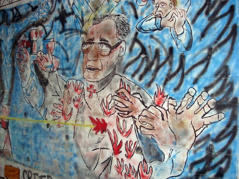 S109.jpg - As Romero was shot, his blood turns into flames of the Holy Spirit.  Mural is in El Despertar Center.