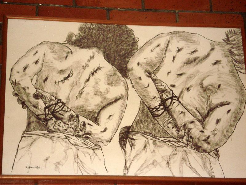 S217.jpg - UCA Chapel:  one of the stations of the cross.  Drawing of bodies tortured by Salvadoran soldiers during civil war.