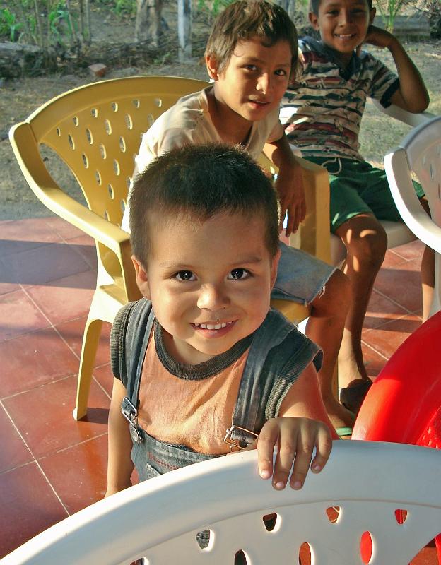 S321.jpg - Older children play with and help care for the younger ones in COO.