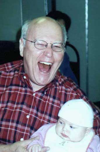 Donald Foster laughs with baby Zoe Springer